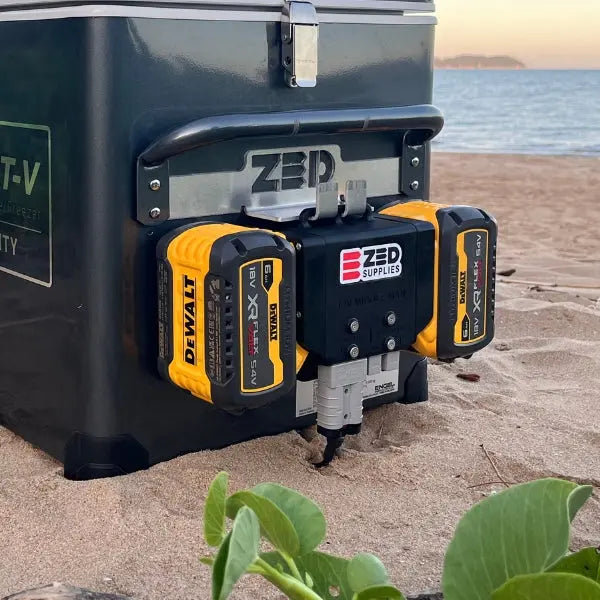 A ZED Middle Man adapter running two DeWALT XR batteries to power a 12V Engel fridge on the beach