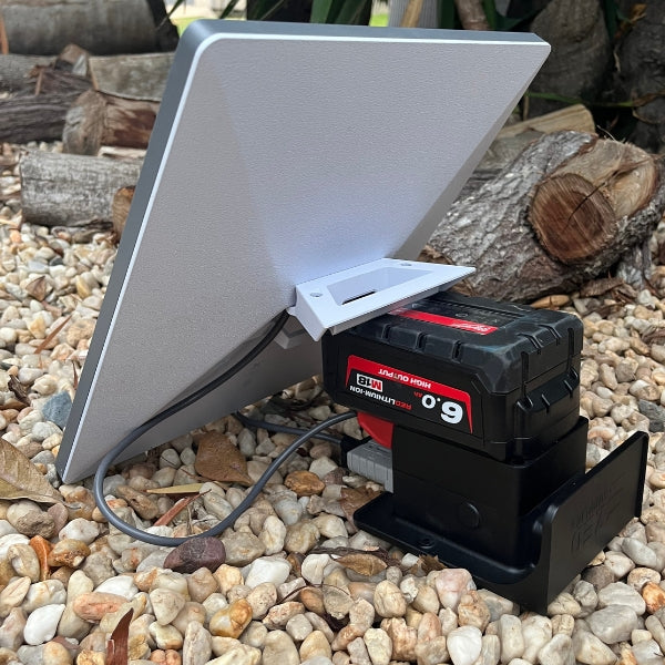 Starlink Mini in the field powered by a Milwaukee 6Ah battery in a ZED 12V adapter tucked behind the dish